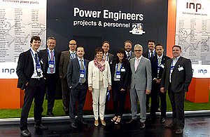 The team of INP in front of the booth at PGE 2014
